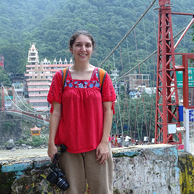 Kell Alley pictured abroad in India with a bridge in the background