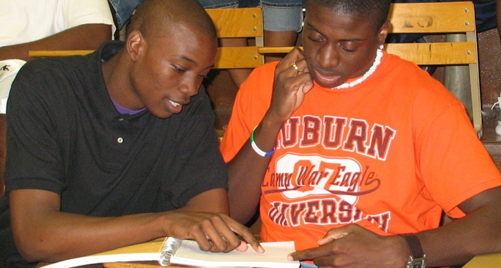 student helping another