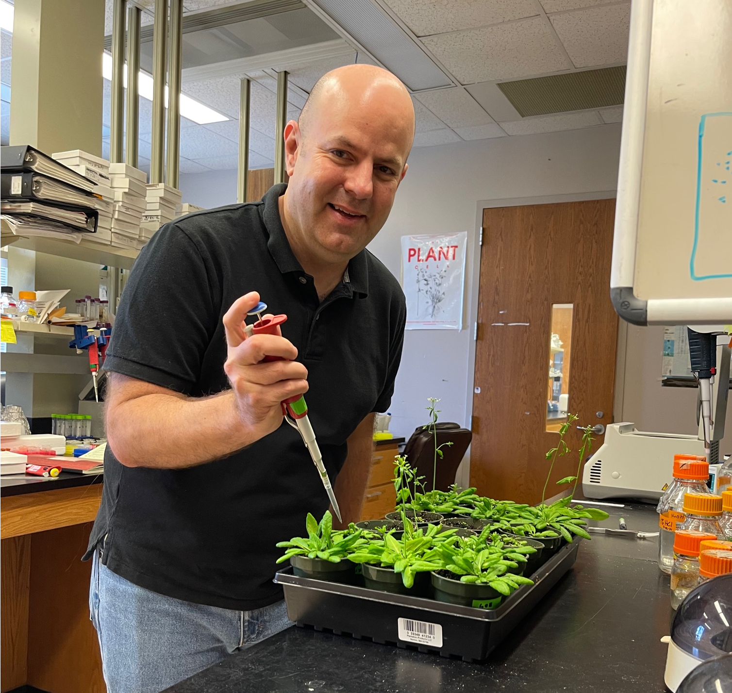 Aaron in his lab working with plants