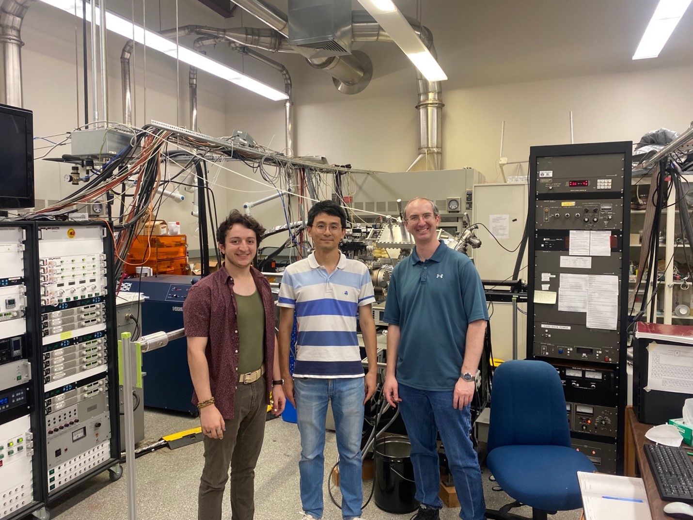 Dr. Jin (middle) and Dr. Comes (right) in the oxide synthesis lab with graduate student Hussam Mustafa (left).