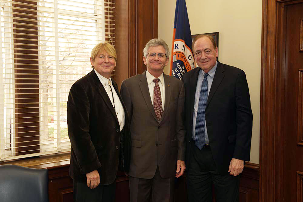 Anna Gramberg, John E. Parkerson Jr. and President Jay Gogue pose for a photo during Parkerson’s visit to Auburn.