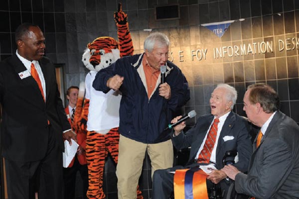 Jay Gogue joins James E. Foy, Pat Dye, Johnny Green and Aubie at the Foy Information Desk during the dedication of the Student Center.