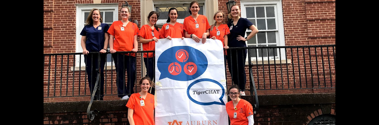 Group of AU Nursing students standing with banner for Tiger Chats