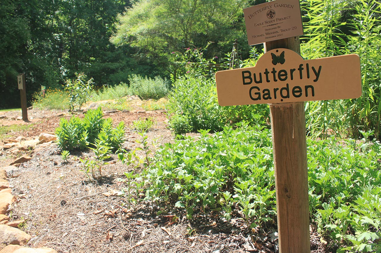 A sign telling the visitor of the Butterfly Garden