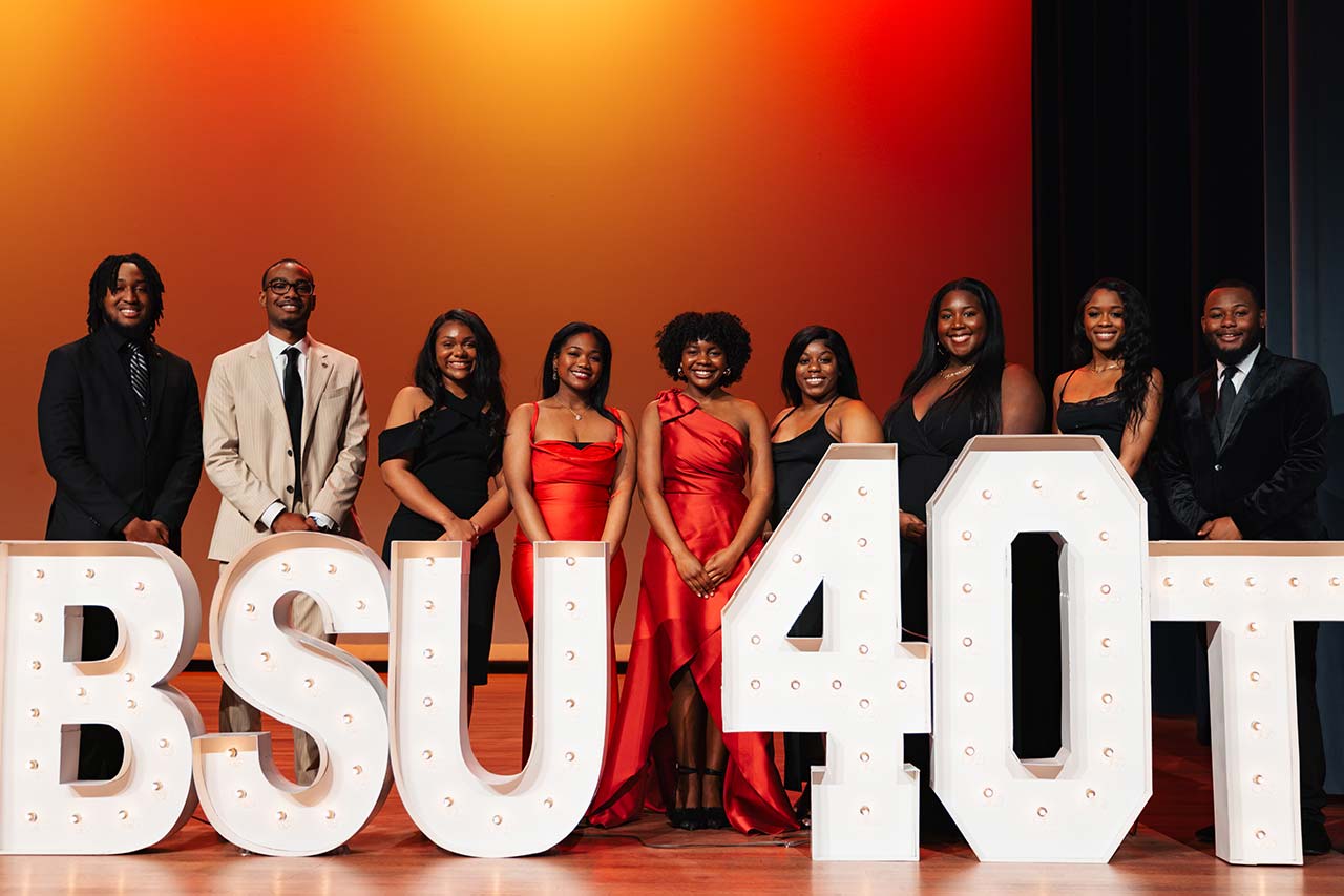 Students stand behind giant letters saying BSU 40th