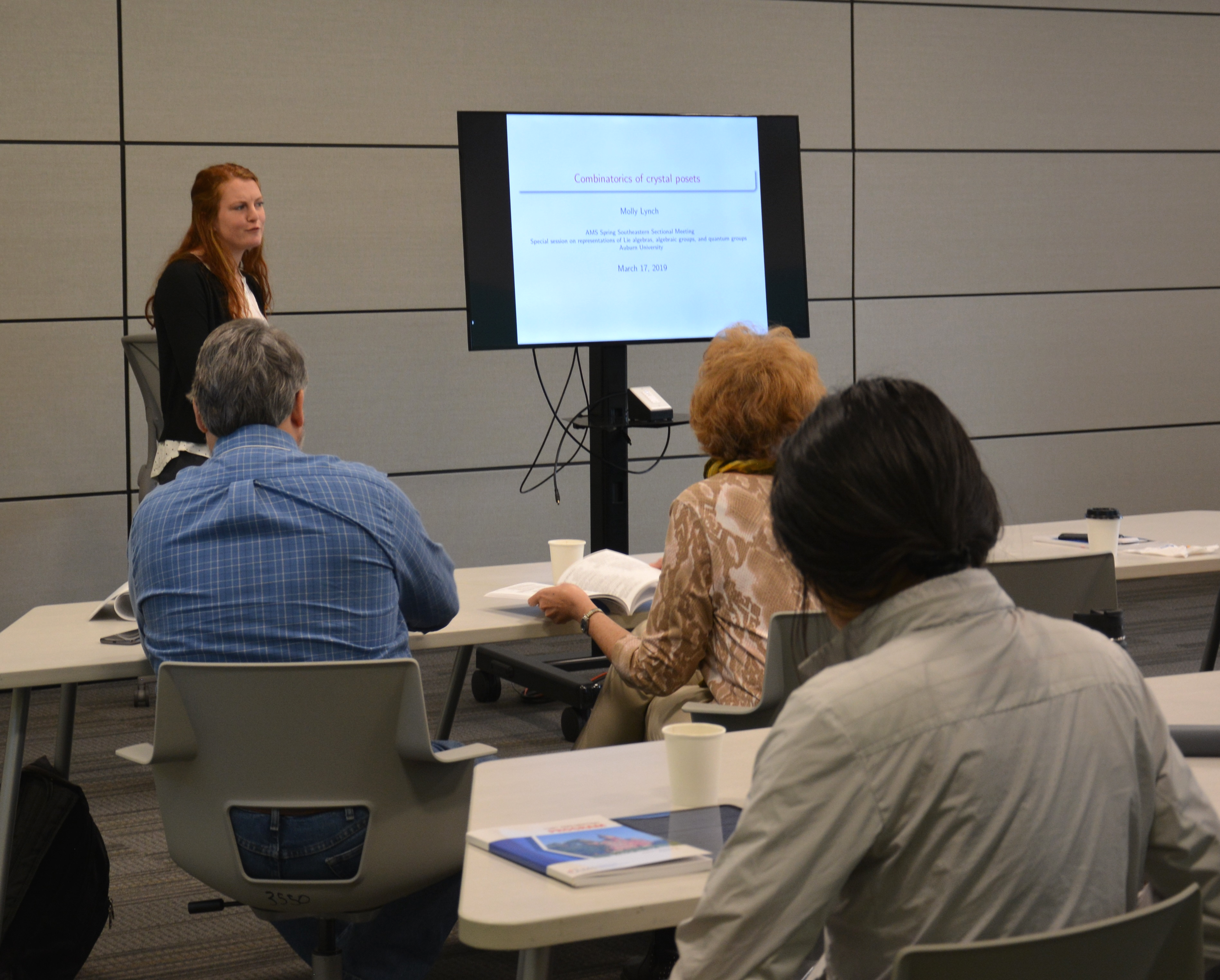Molly Lynch speaking on the topic of Combinatorics of crystal posets at the American Mathematical Society.