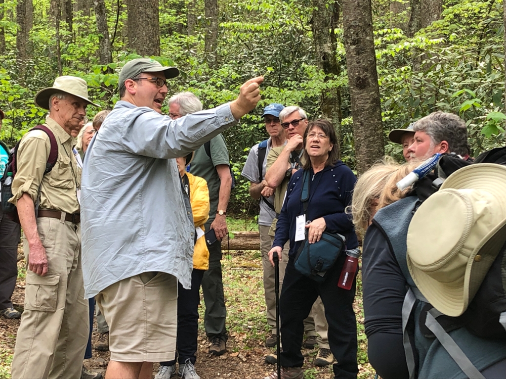 Brian Keener in the field with visitors
