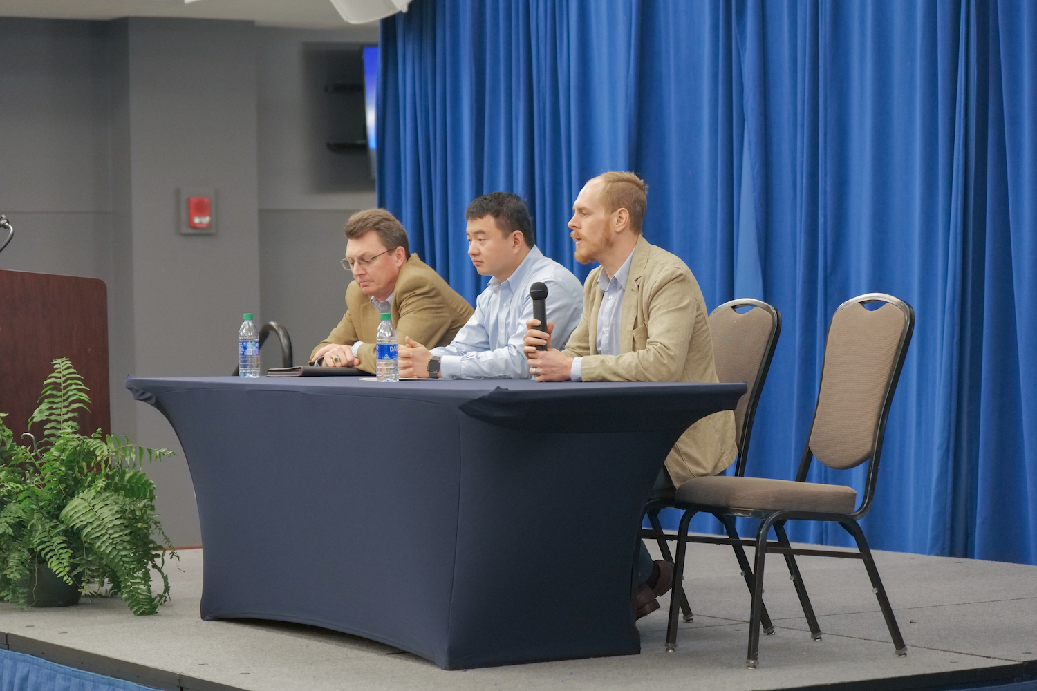 Poole participating on a panel at this year's conference.