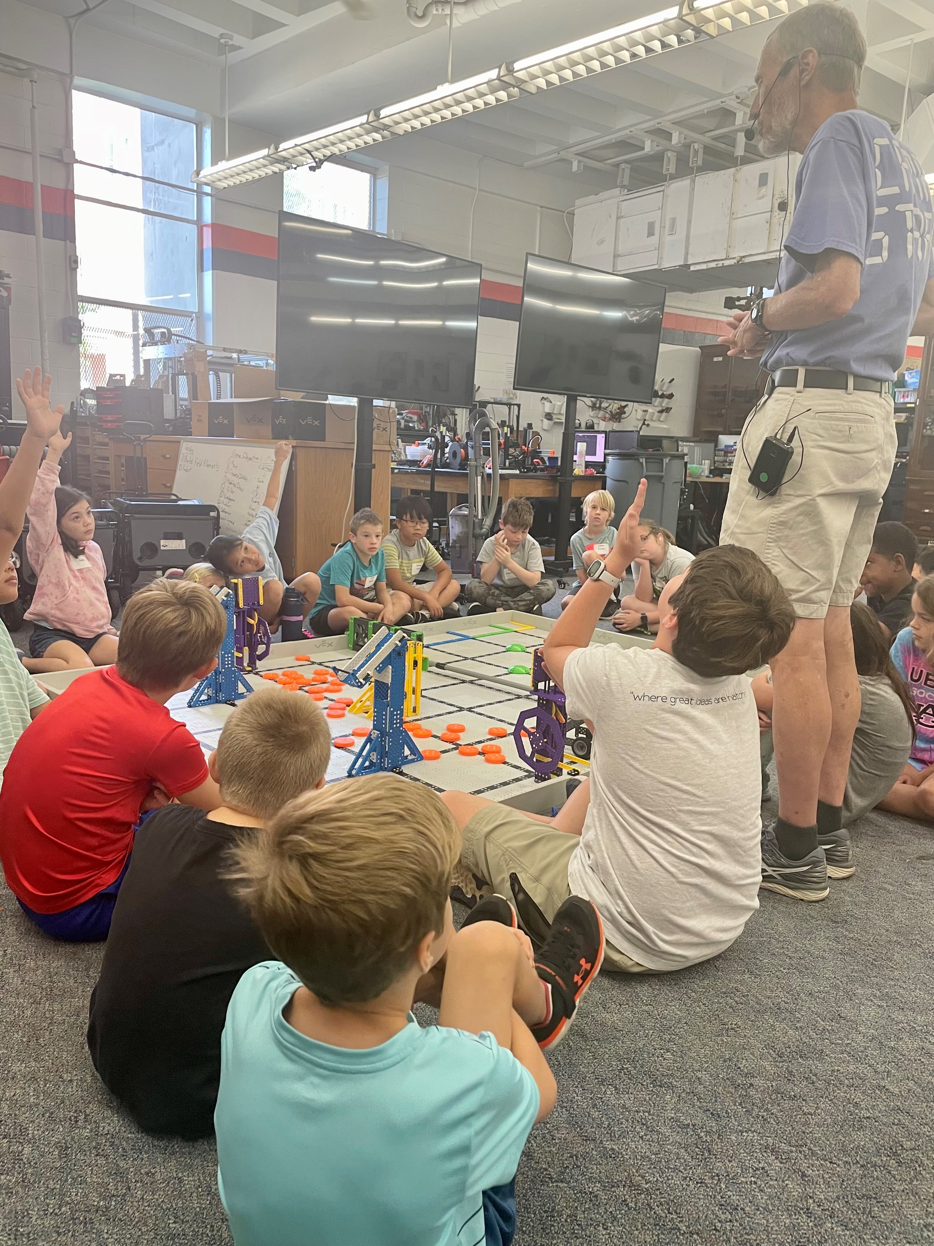 VEX IQ campers share ideas with Dr. Zutter on how to improve their robot for competition.