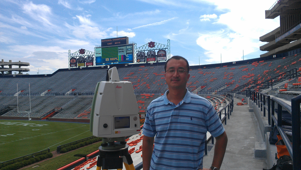 Professor Junshan Liu from the School of Building Science, scanning the interior of Jordan-Hare Stadium