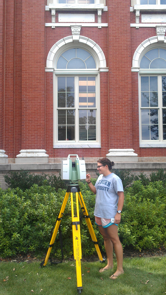 Student Caitlin Clark scanning the exterior of Comer Hall