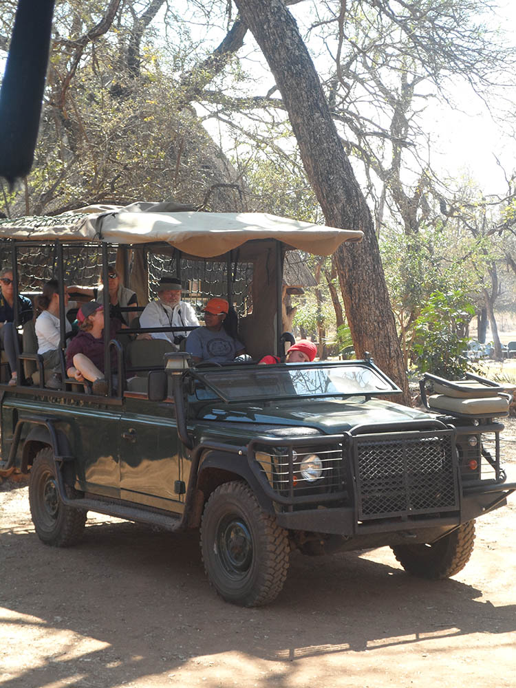 Troy Best and students riding in a truck in Swaziland
