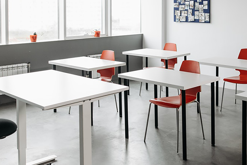 Desks in a classroom scene
