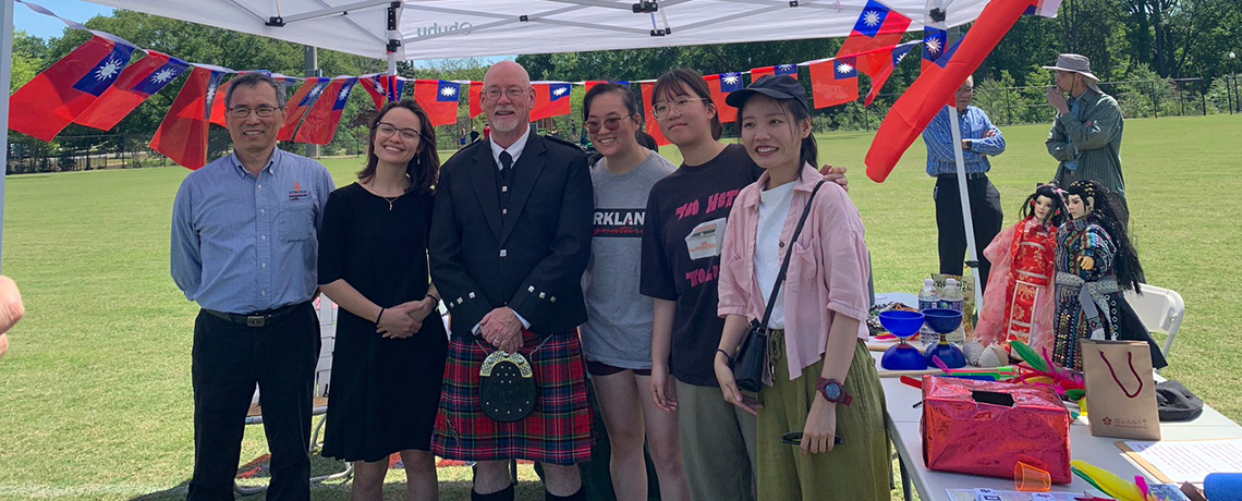 Dr. Gillespie and AU-NCKU Taiwan Center faculty outside under a tent on campus