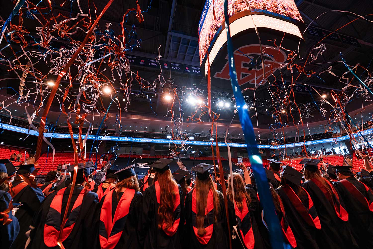 Fall 2025 Commencement students celebrating with confetti