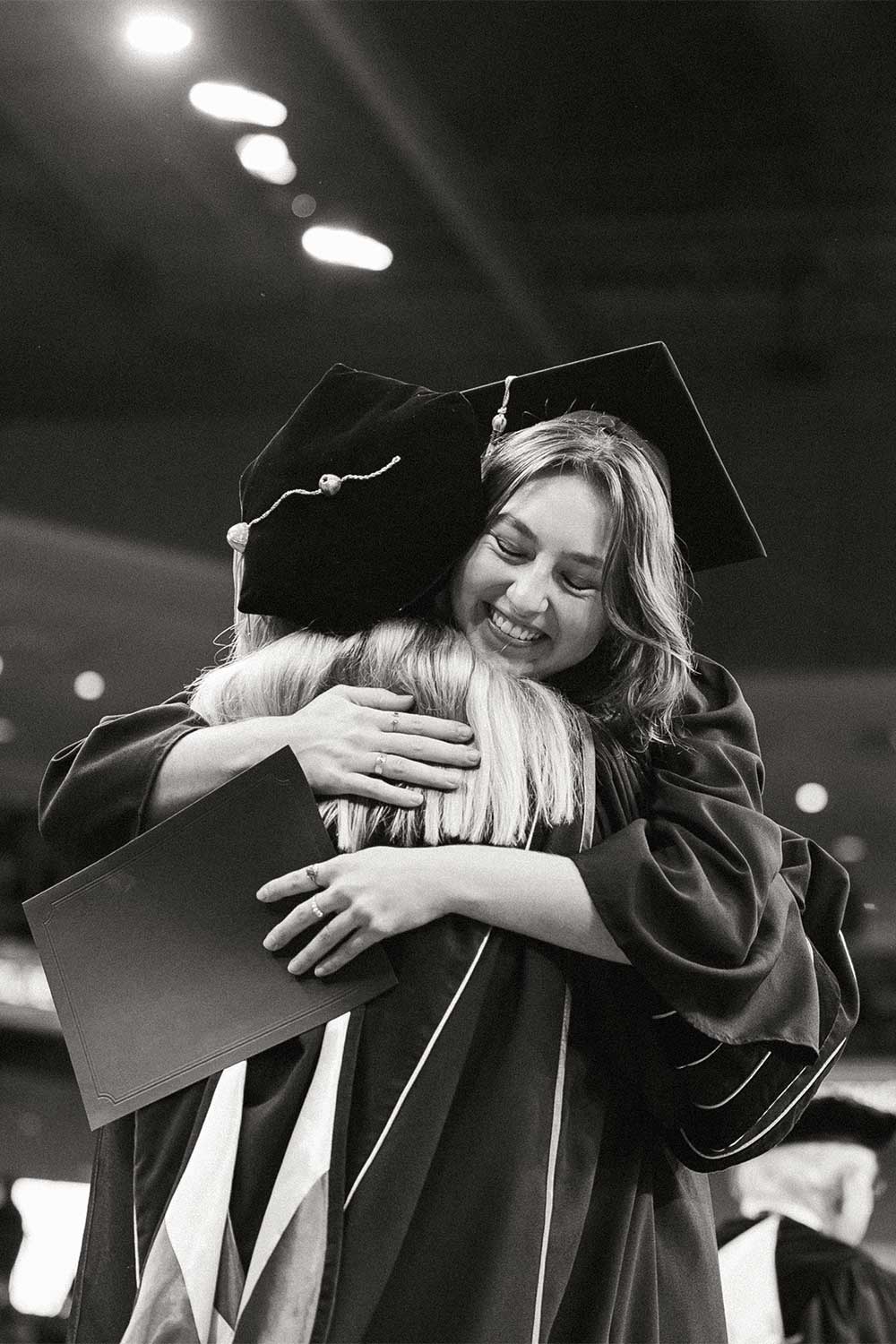 Fall 2025 Commencement Student Accepting Degree and hugging