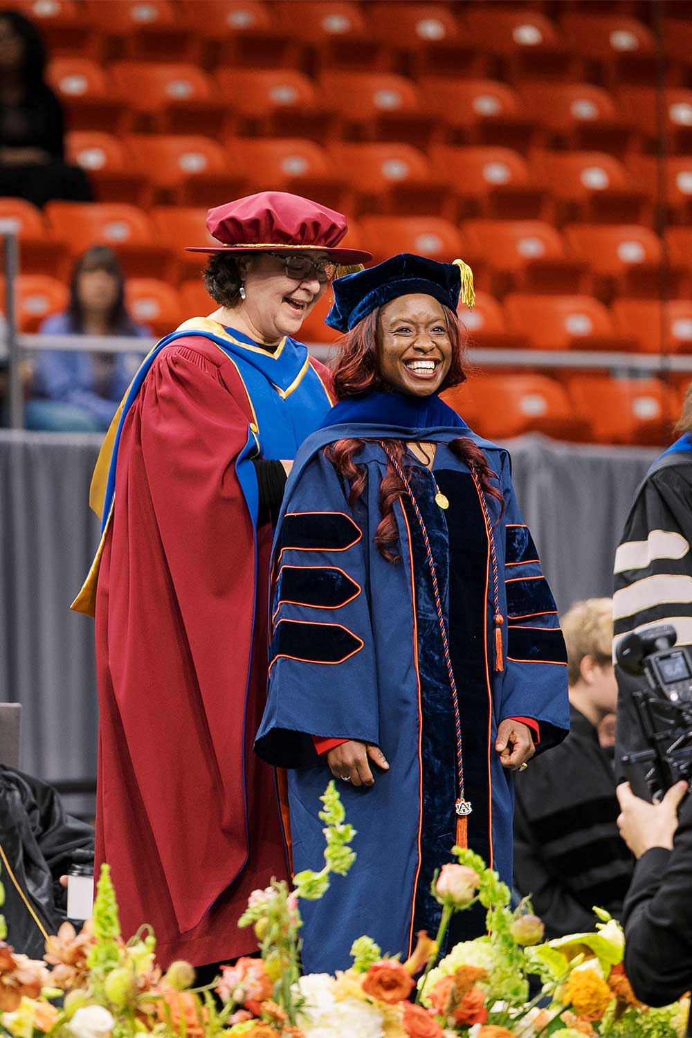 Fall 2025 Commencement student being hooded