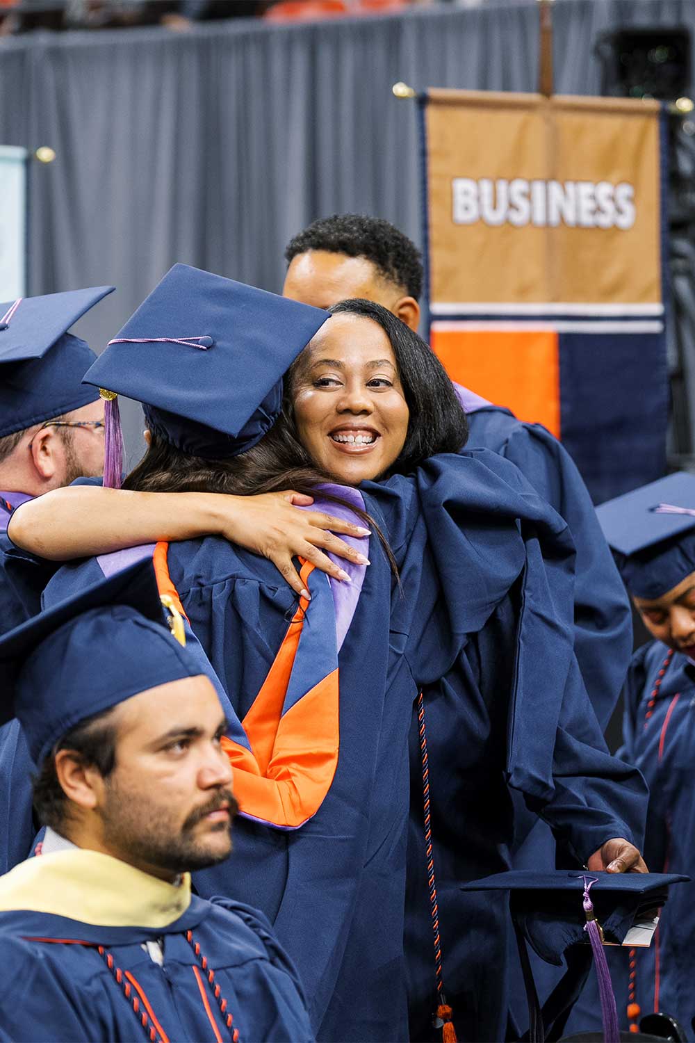 Fall 2025 Commencement Students Hugging