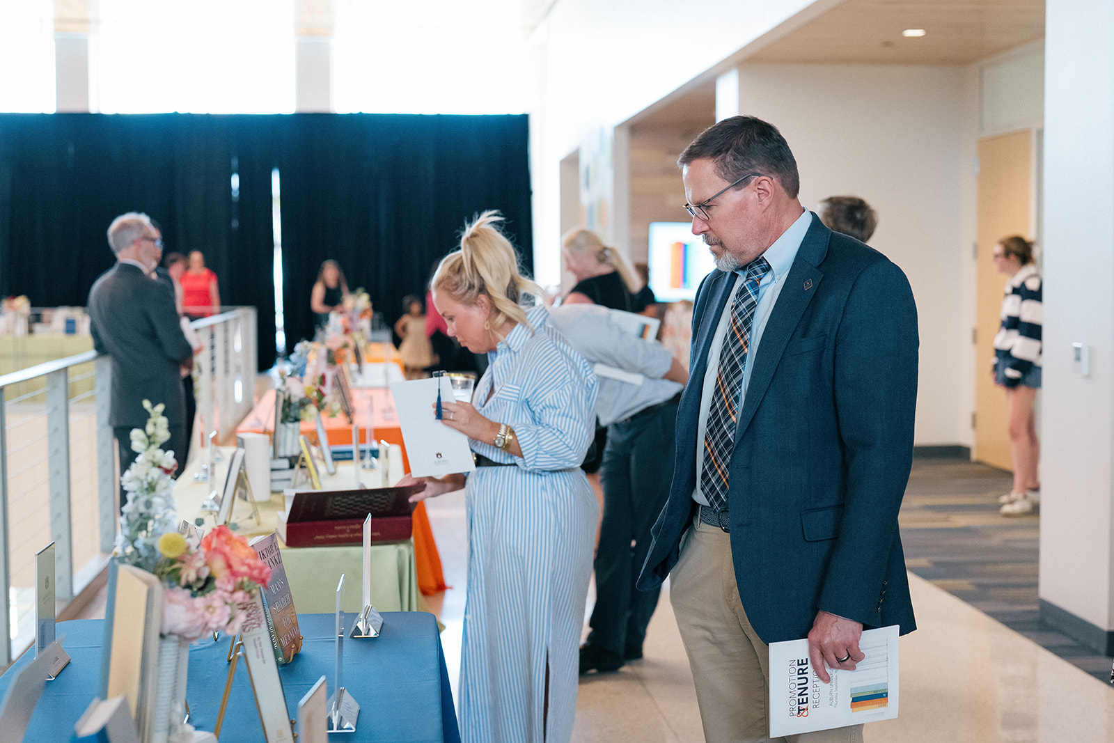 Promotion and Tenure 2024-2025 attendees reading book selections