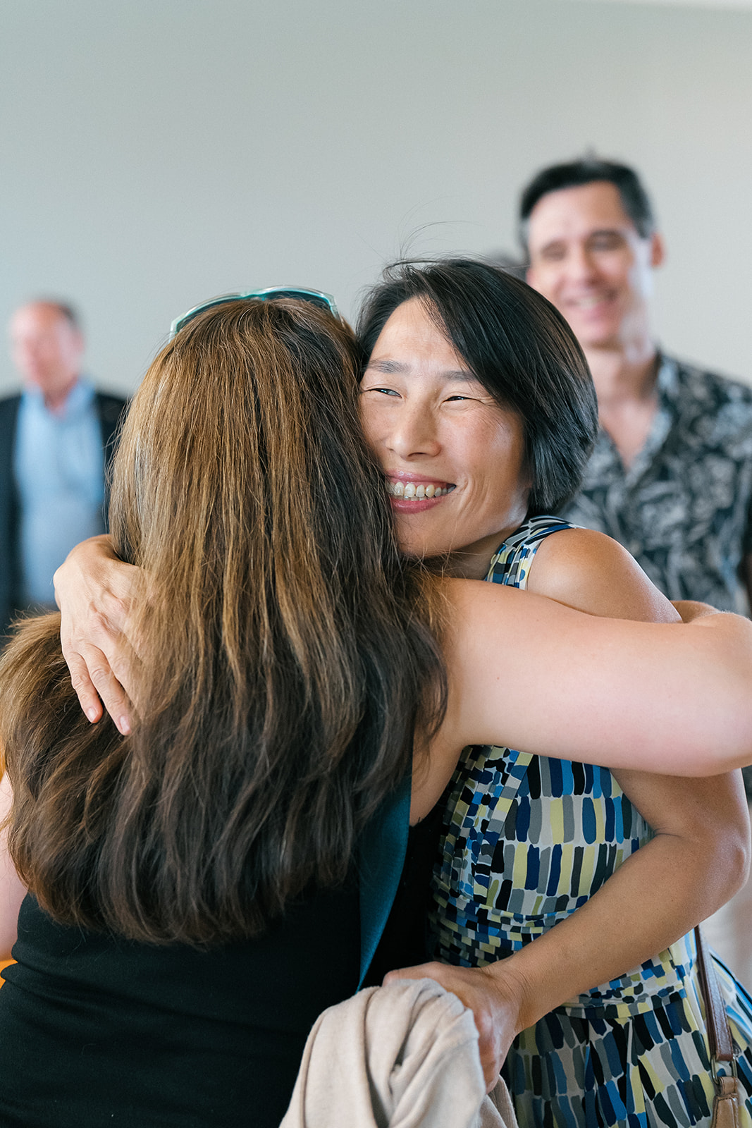 Promotion and Tenure 2024-2025 attendees hugging