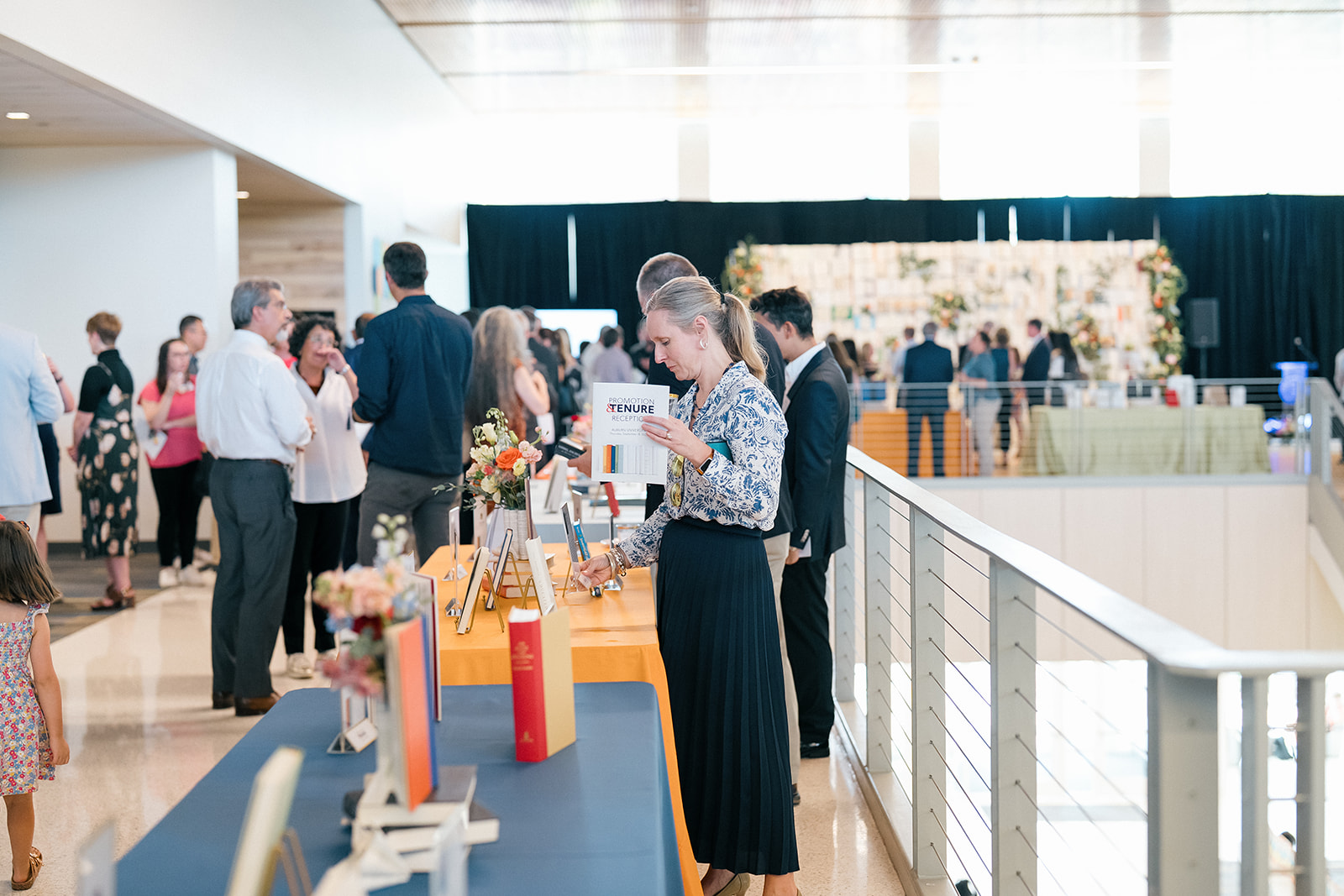 Promotion and Tenure 2024-2025 attendee reading