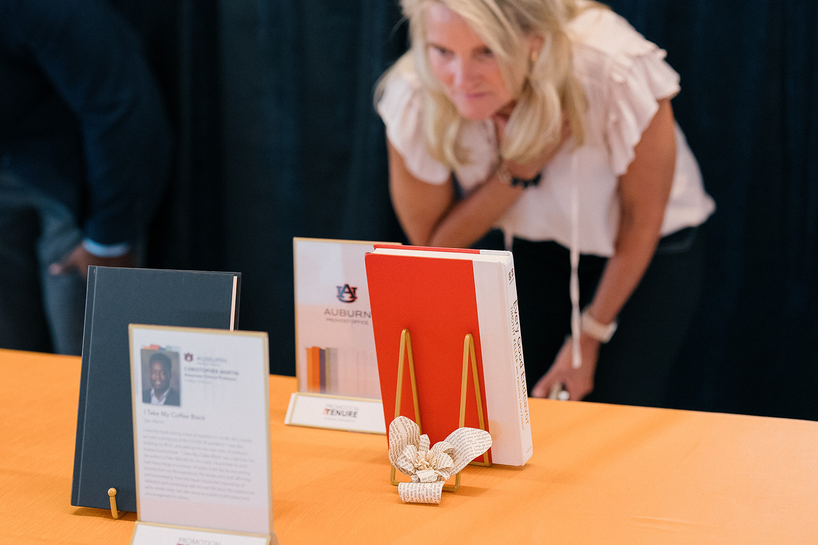 Promotion and Tenure 2024-2025 attendee reading