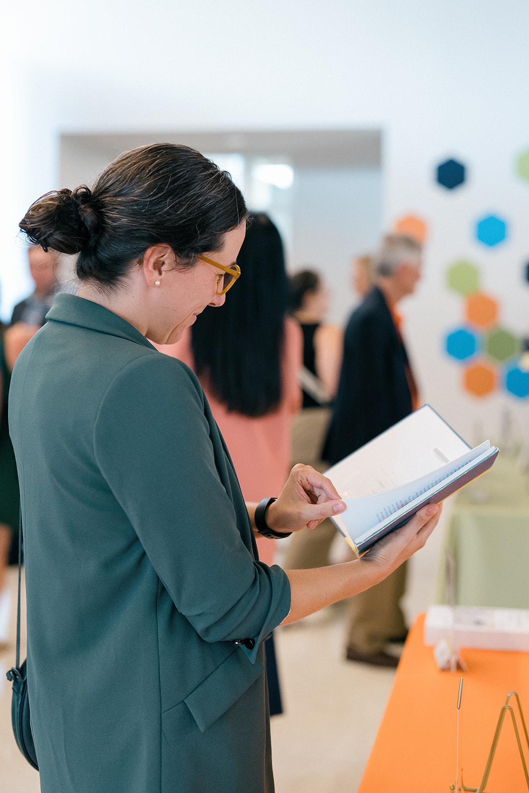 Promotion and Tenure 2024-2025 attendee reading
