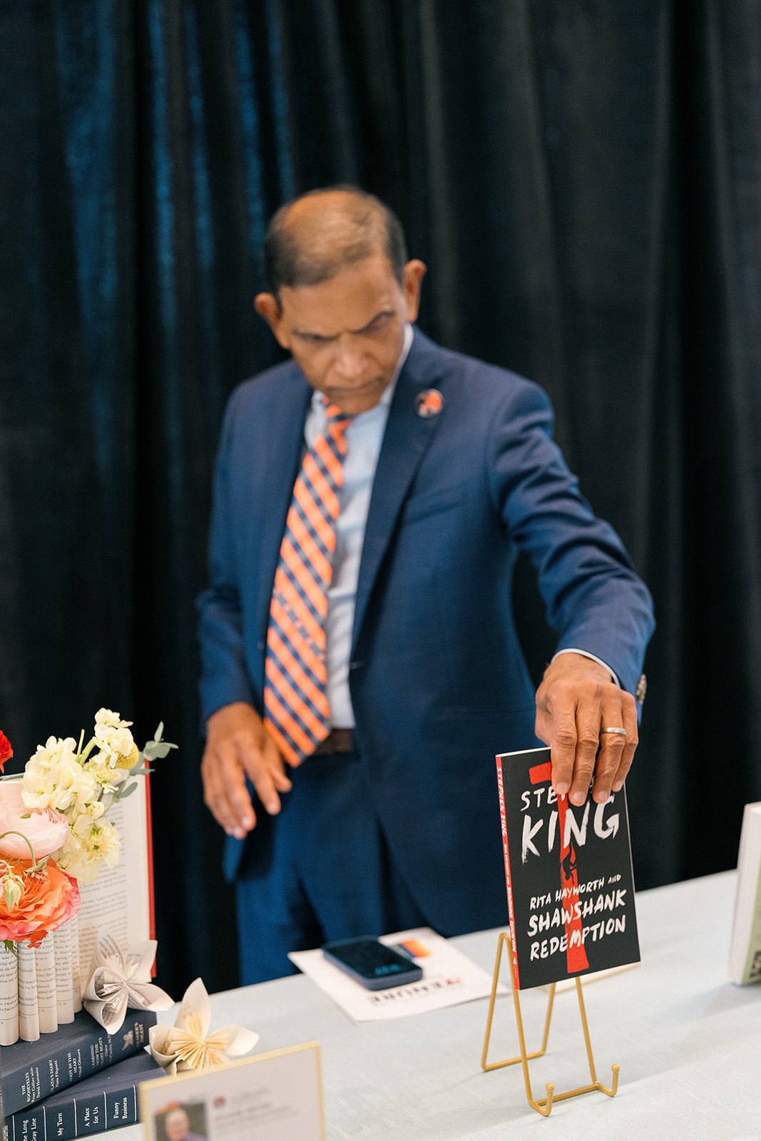 Promotion and Tenure 2024-2025 attendee reading book