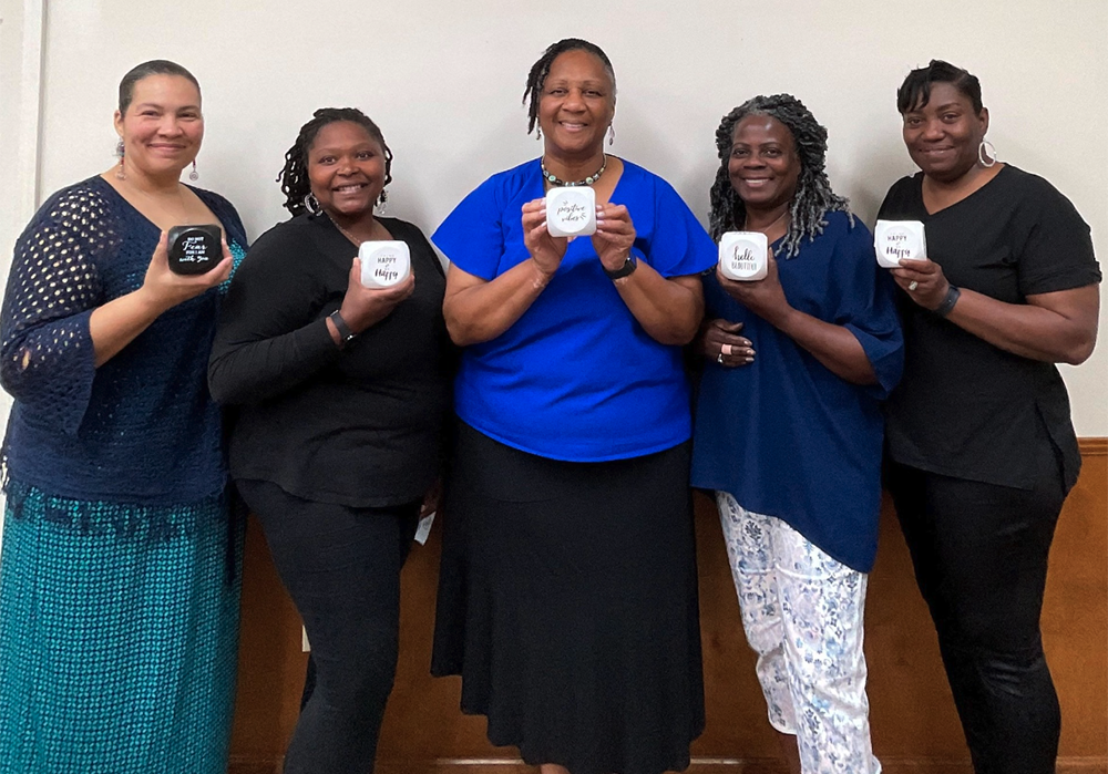 Auburn employees with plaques