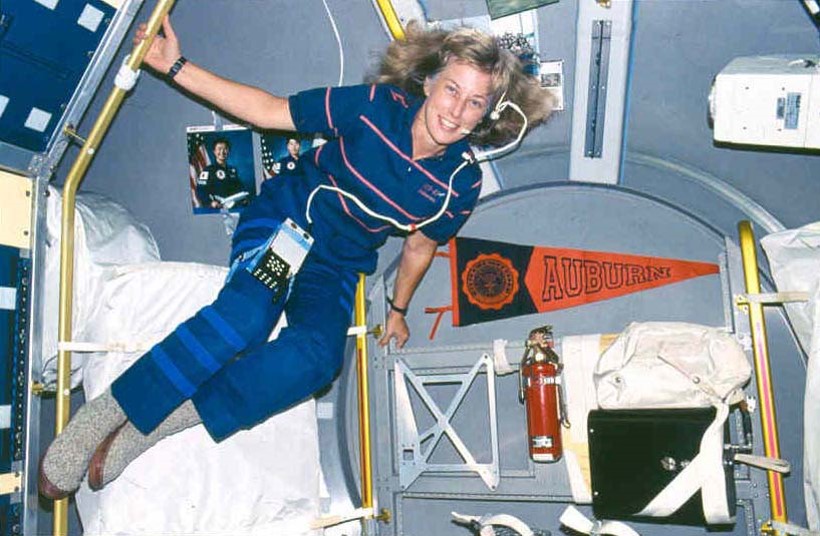 Davis floats inside a vehicle in space