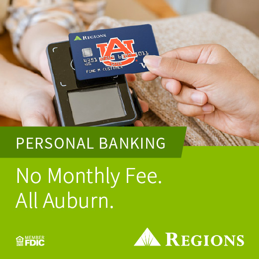 Close-up of a Regions debit card with Auburn University logo being used at a payment terminal. Text reads: 'Personal Banking. No Monthly Fee. All Auburn.' Followed by Regions, FDIC, and FHA logos.