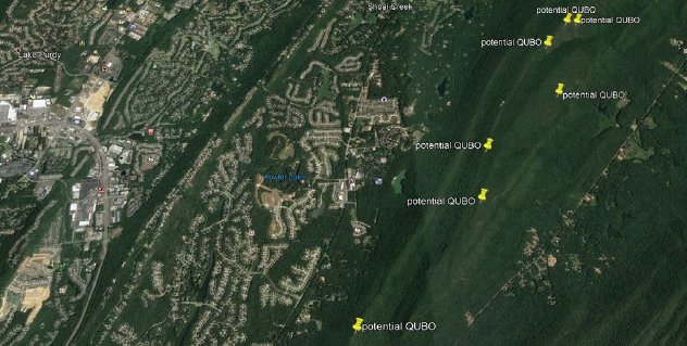 Outcrops have been pinned as potential spots to find QUBO on the ridge of Double Oak Mountain. In this photo you can see Oak Mountain runs parallel to the west. The ridge habitat has been replaced with a string of houses