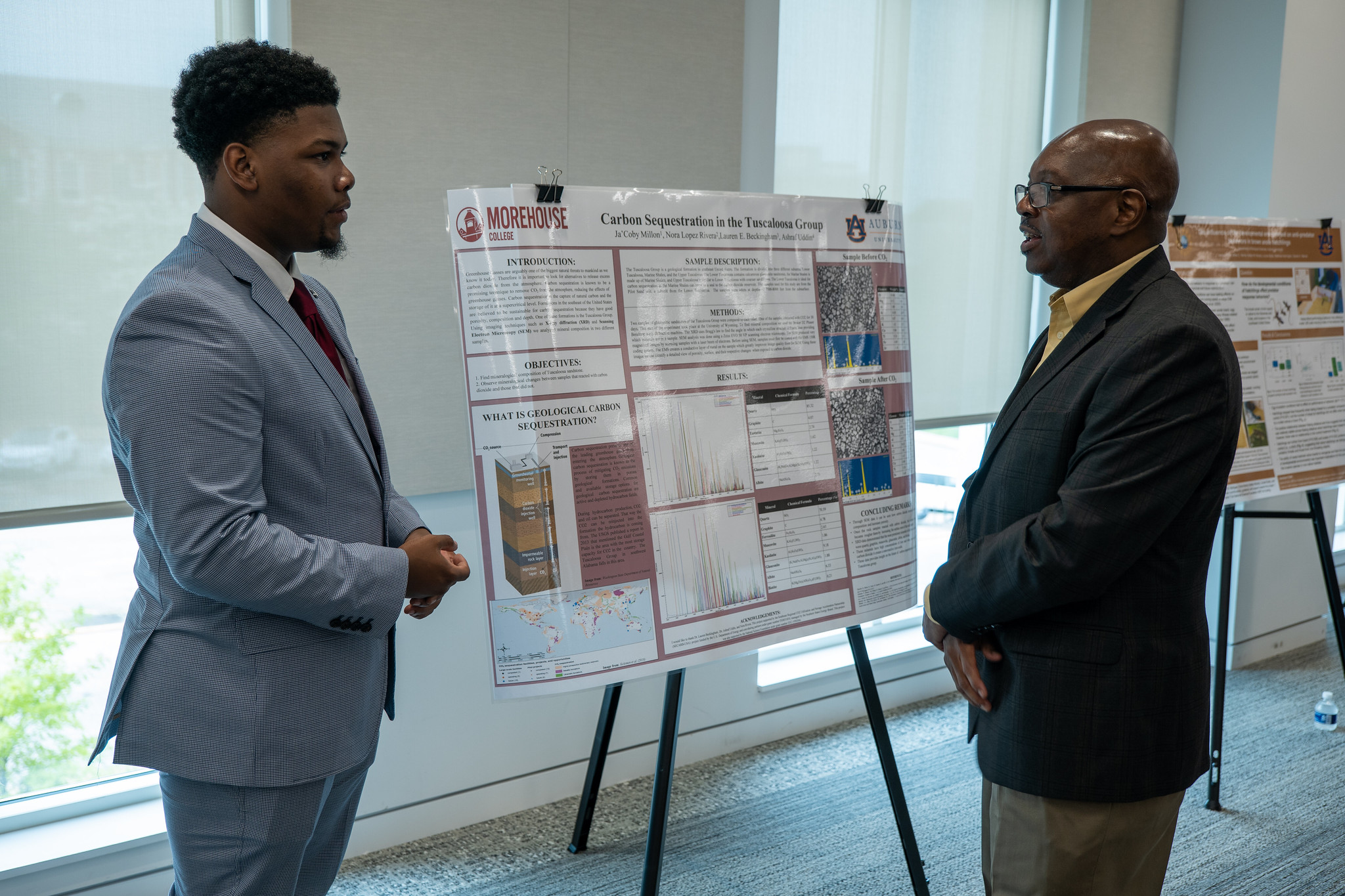 student_with_poster_2_reu_23.jpg