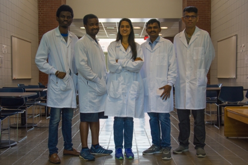 Dr. Monika Raj and her team in the Chemistry Building. 