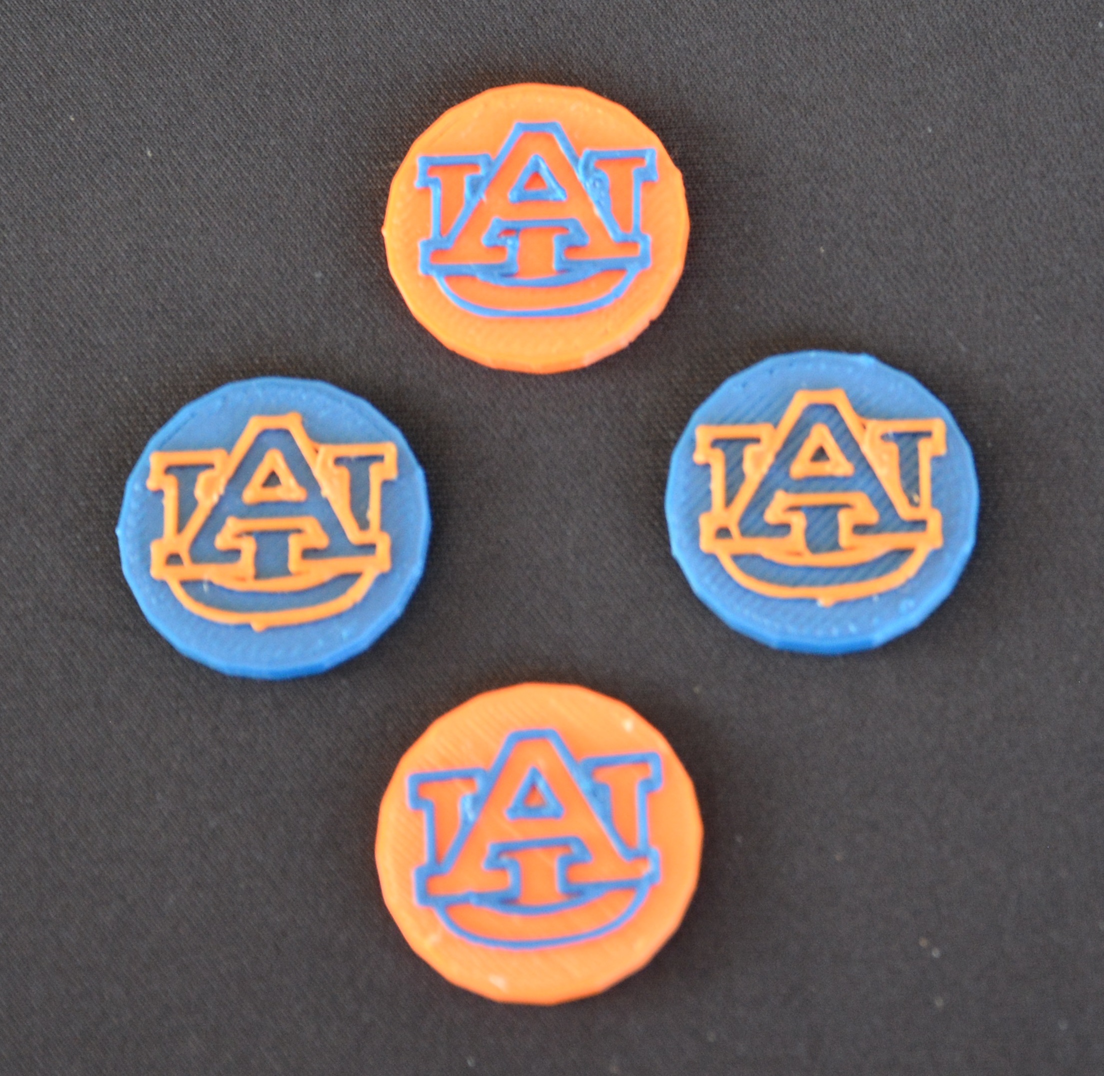Ball markers made through 3D printing by SCORE for the tournament. 
