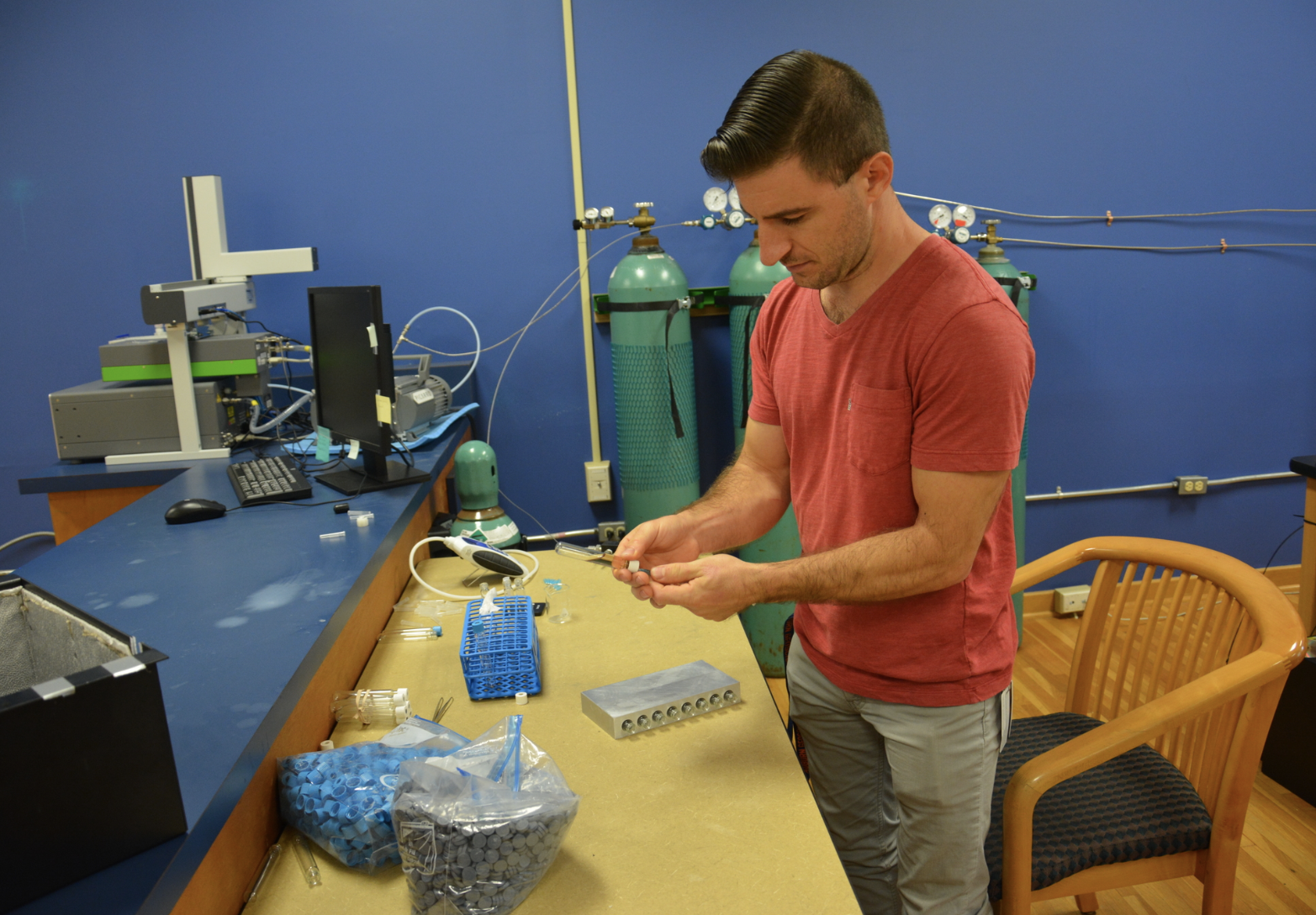 Dr. DeCesare acidifying samples for data collection in the mass spectrometer.