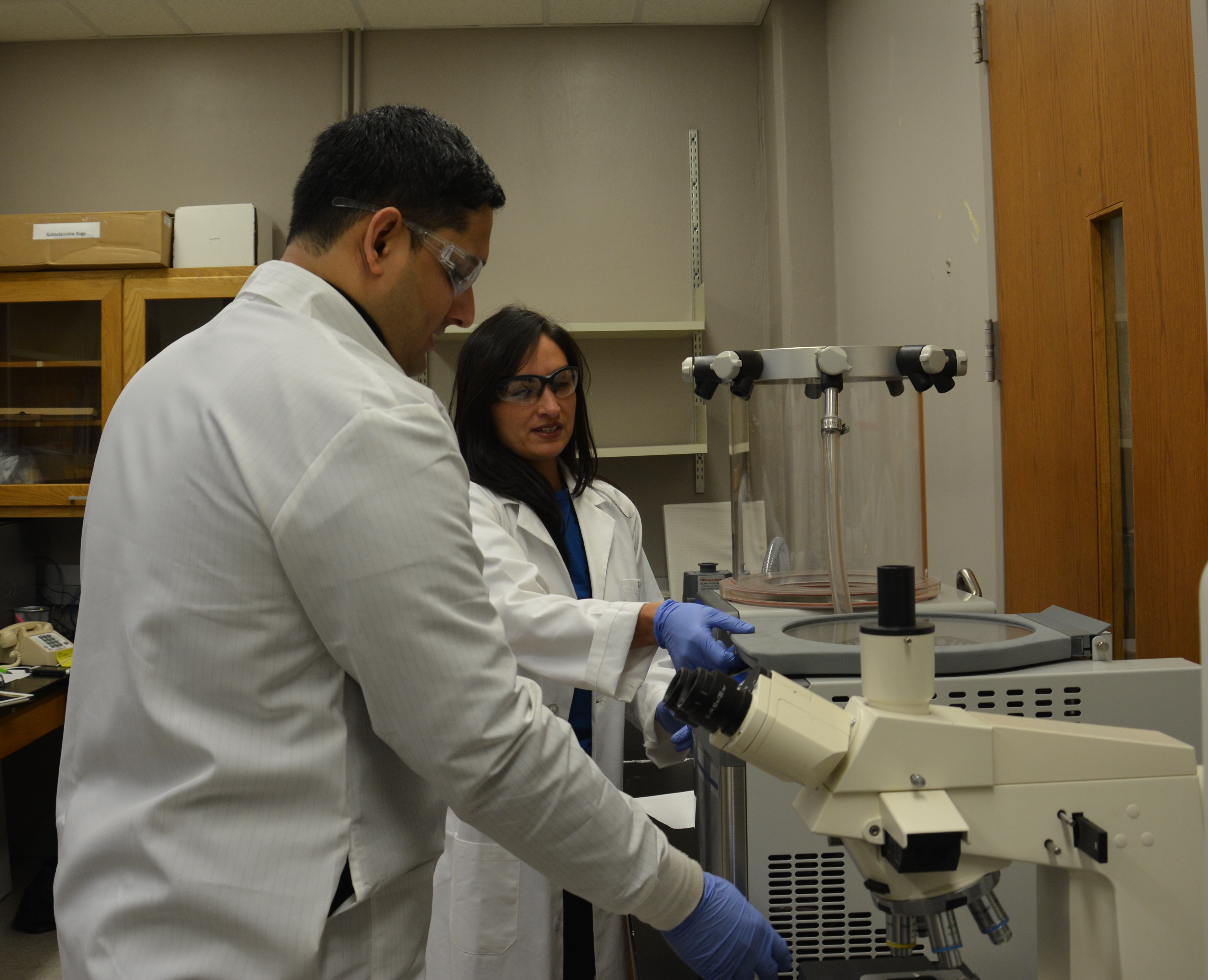 Nitish Kunte, a Ph.D. student, and Dr. Flores testing samples.
