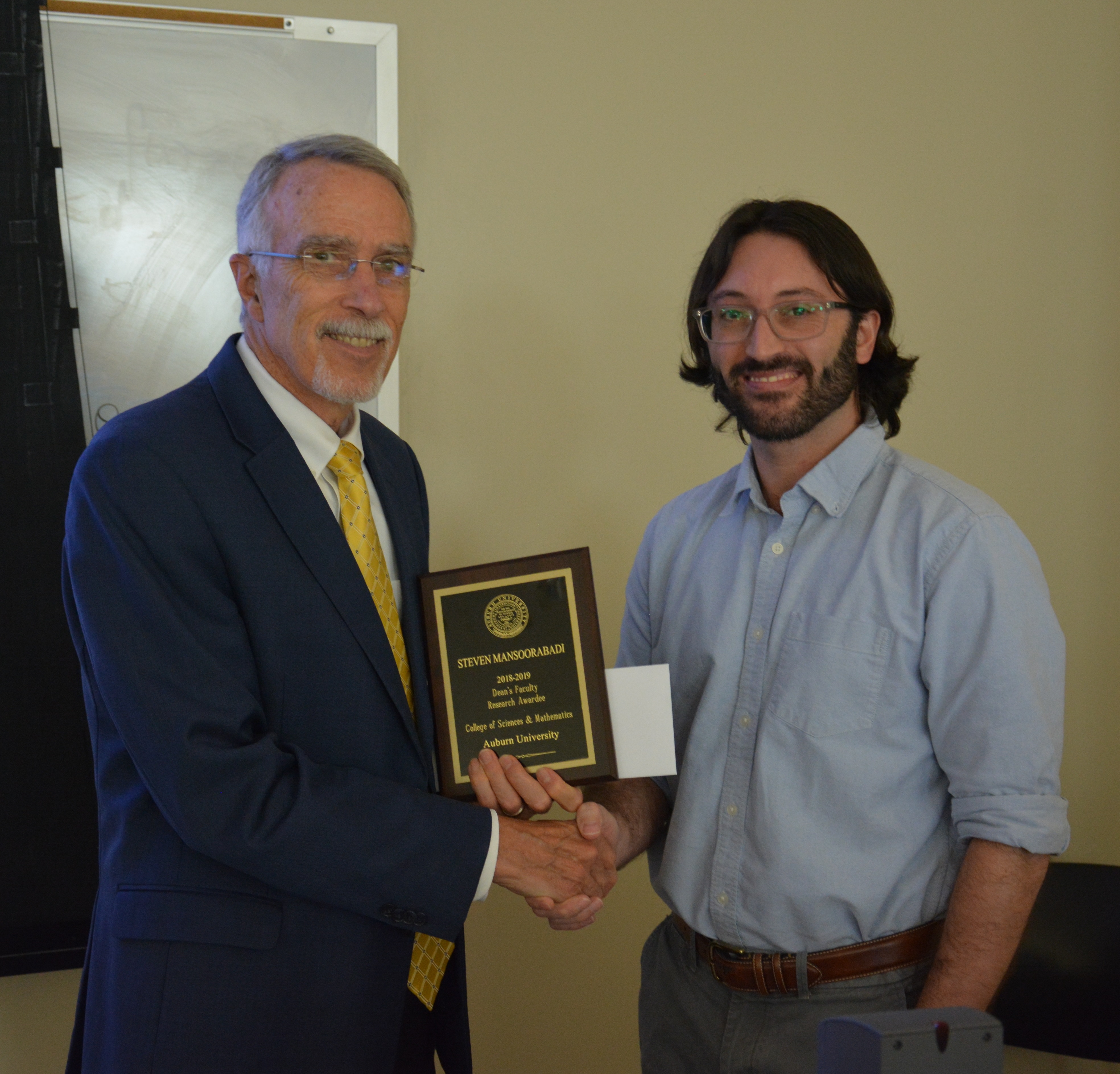 Dean Giordano with Dr. Steven Mansoorabadi at the Dean's Research Awards program.