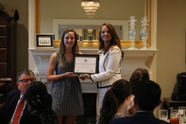Chloe Haverkamp receiving the award from Dr. Tiffany Sippial, Director of the Honors College, at the Honors College Director’s Reception Dinner.
