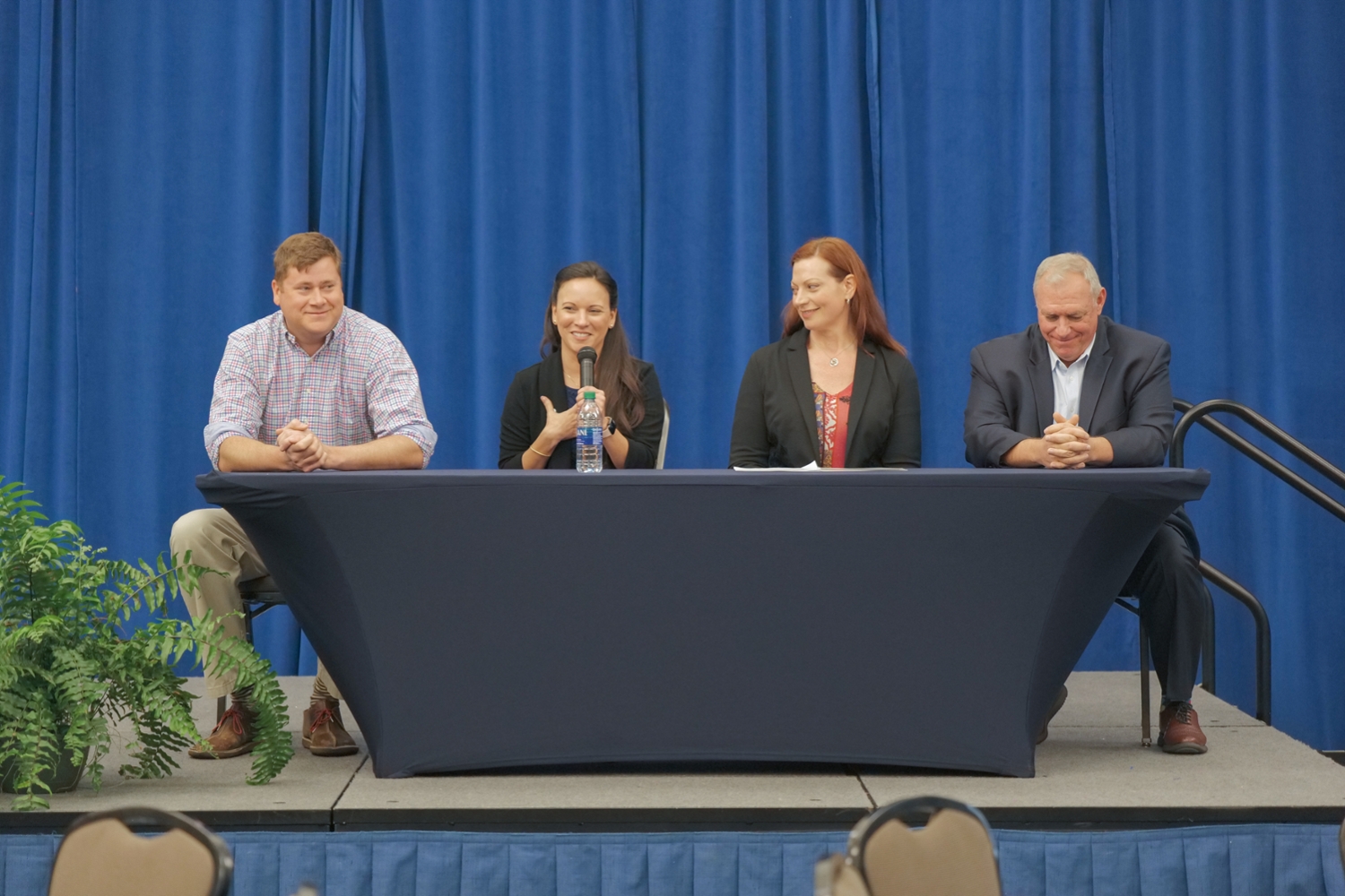 A group of speakers participate in an engaging panel discussion. 