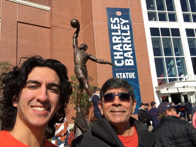 Saad El-Zanati (right) with his son Michael (left) in February 2020 at the Auburn Arena. 