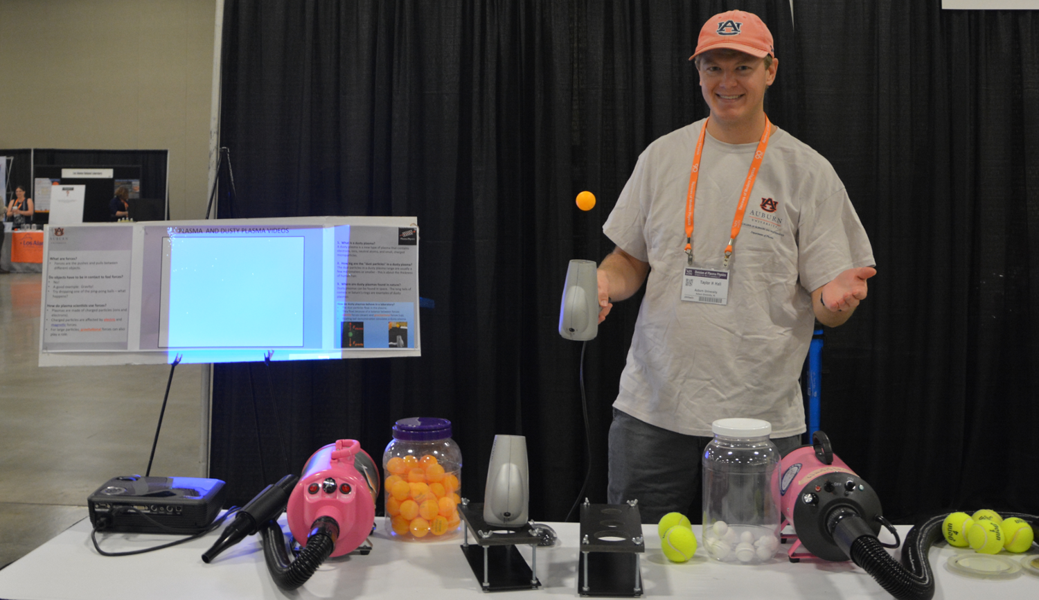 Taylor Hall demonstrates plasma physics to local students at the he 61st Annual Meeting of the APS Division of Plasma Physics held in Fort Lauderdale, Florida.