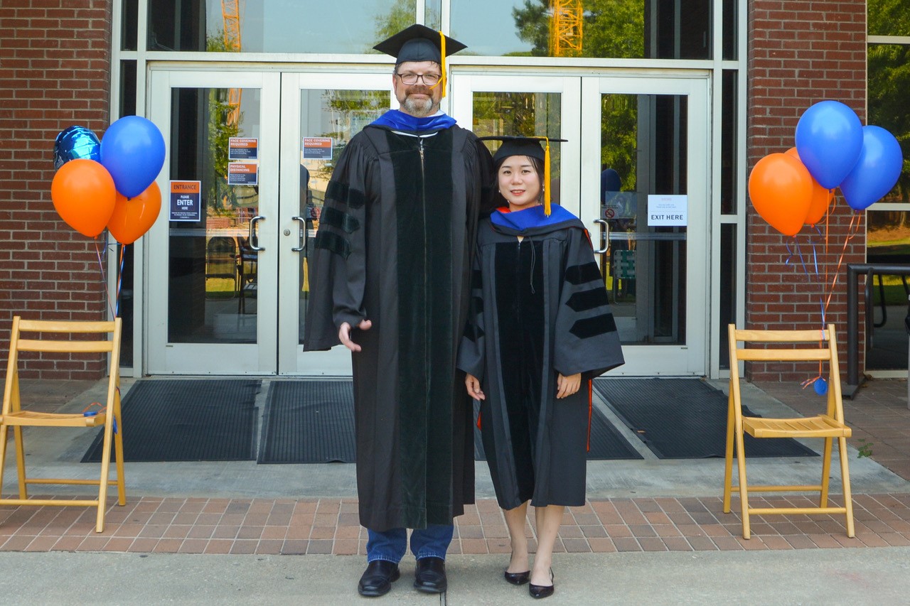Department of Chemistry and Biochemistry Chair Doug Goodwin with Hui Xu.