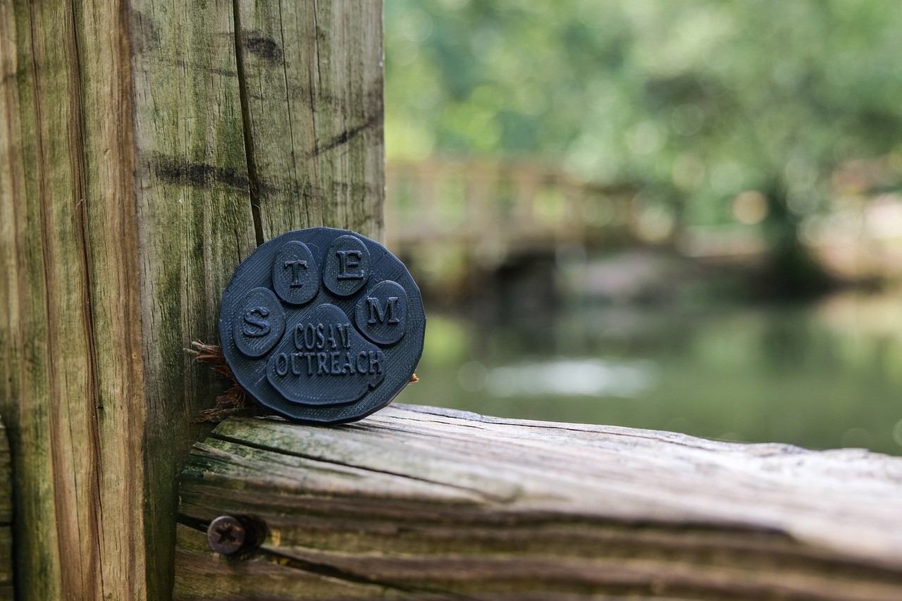 Are you up to the challenge? Get outdoors and find a souvenir coin with the #COSAMCampusCache.