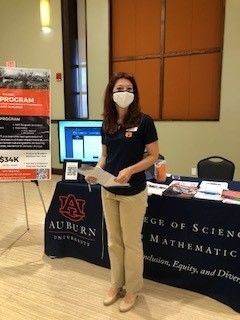 Katie Brown in front of the Auburn University table at the FAMU Graduate School Recruitment Fair.