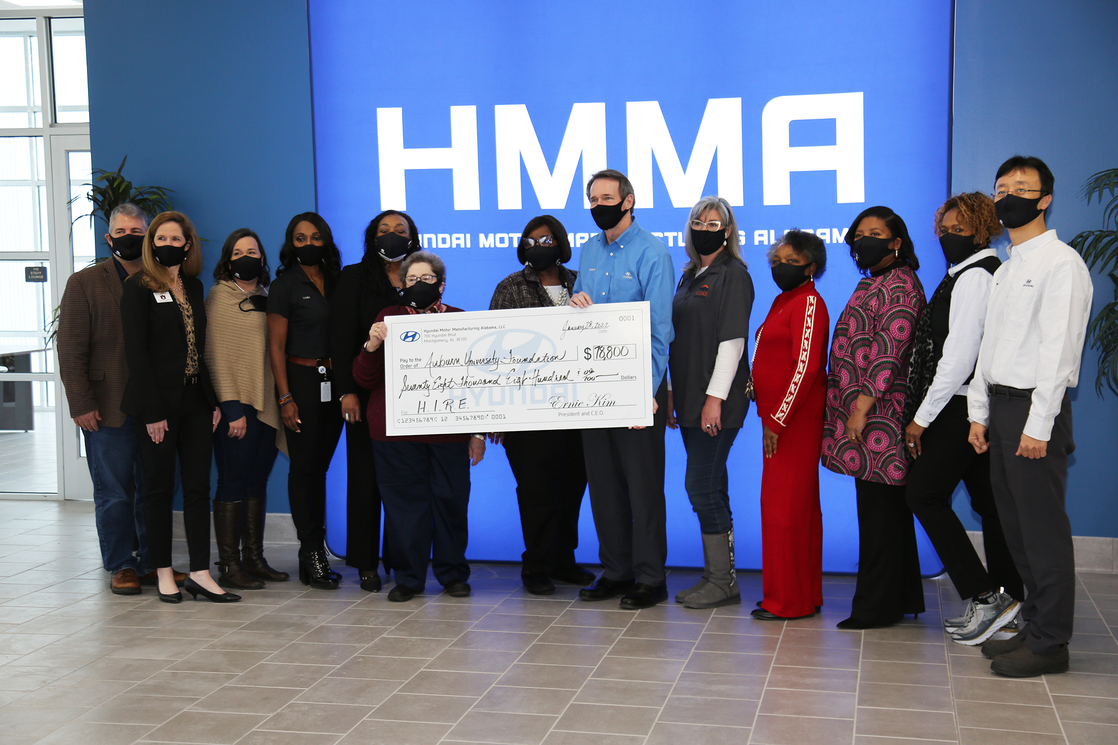 Check Presentation Photo with a group of people holding a check