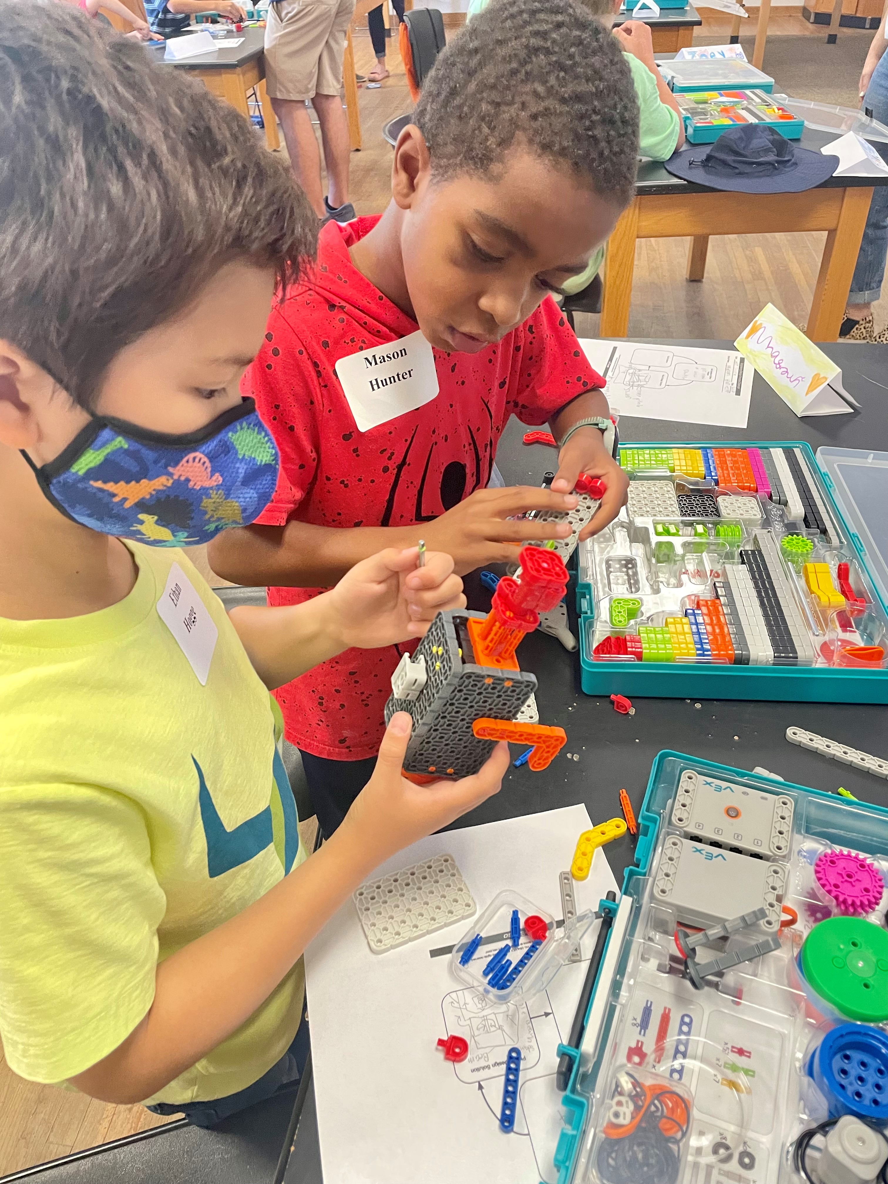 Students working on VEX robotics together