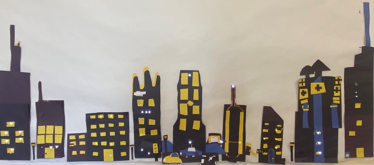 A close up image of the illuminated skyscrapers constructed by Makey Makey campers.