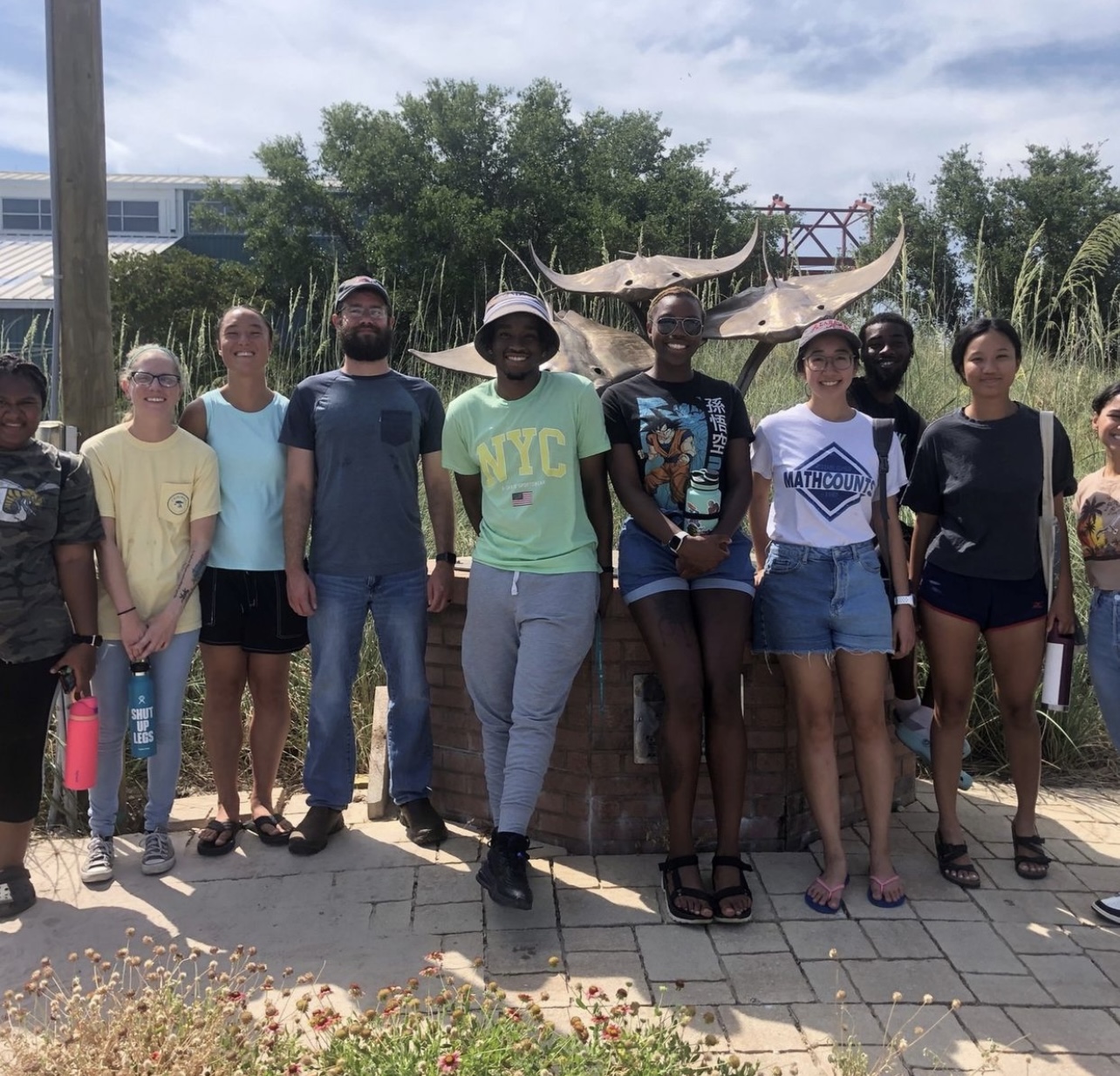 Hall is pictured with her DISL REU group while on a tour of the Alabama Aquarium. 