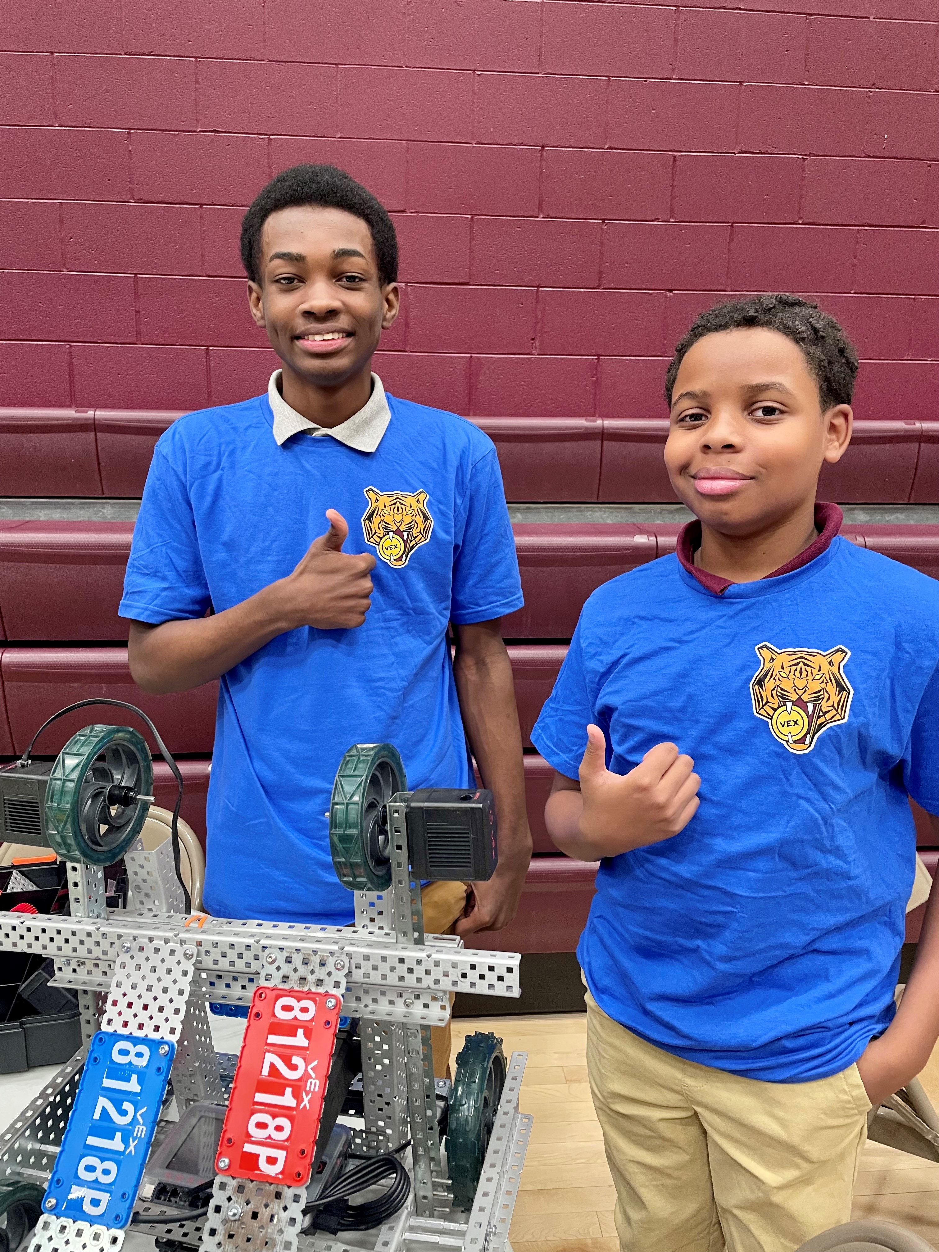 LAMP High School 10th graders Tyler Stokes and Christian Robinson display their robot before competition begins.